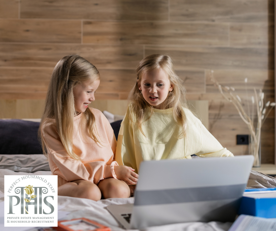 Two sisters sitting together with a notebook, demonstrating managing siblings through shared activities and cooperation.