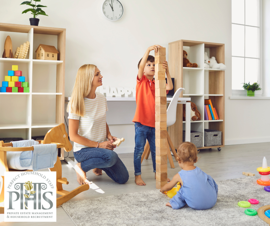 Nanny playing in a room with two children, demonstrating sibling relationship tips for nanny to encourage cooperation and bonding..